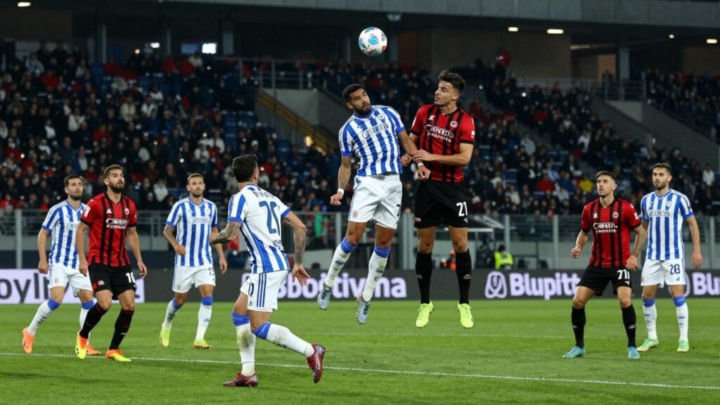 Coppa Italia final match action with determined players.
