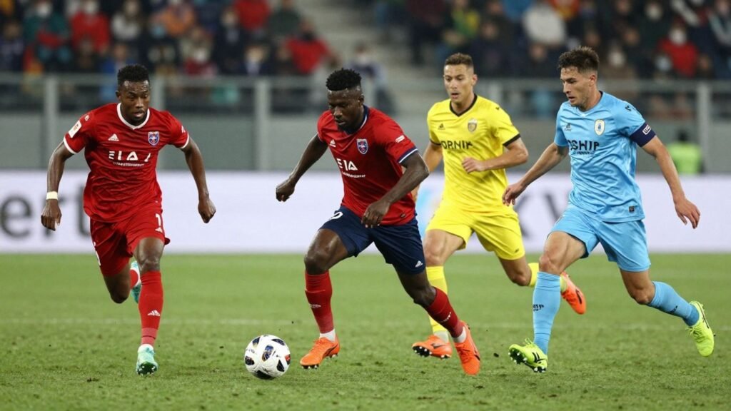 Serie B football match action with players on the pitch.