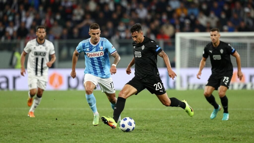 Coppa Italia football match action on green pitch.