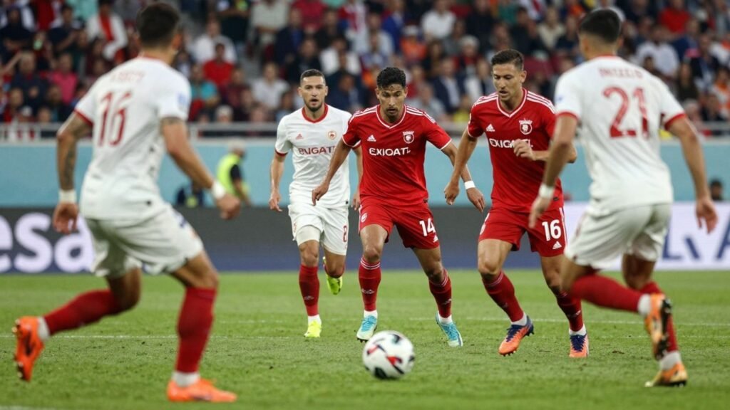Live football match action with players and ball.