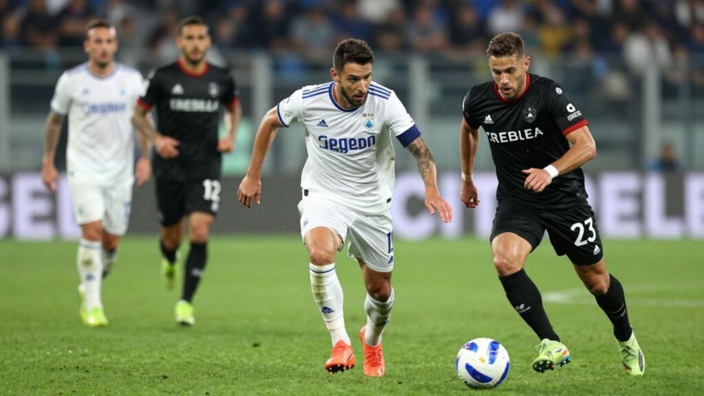 Serie A football match in progress on a green pitch.